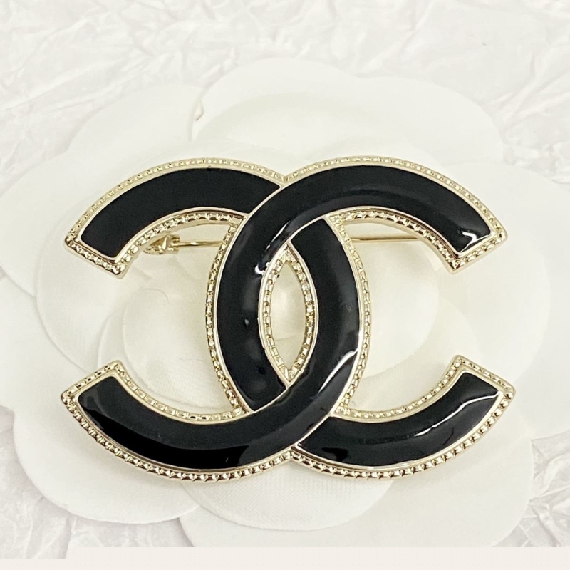 Ch*el brooches